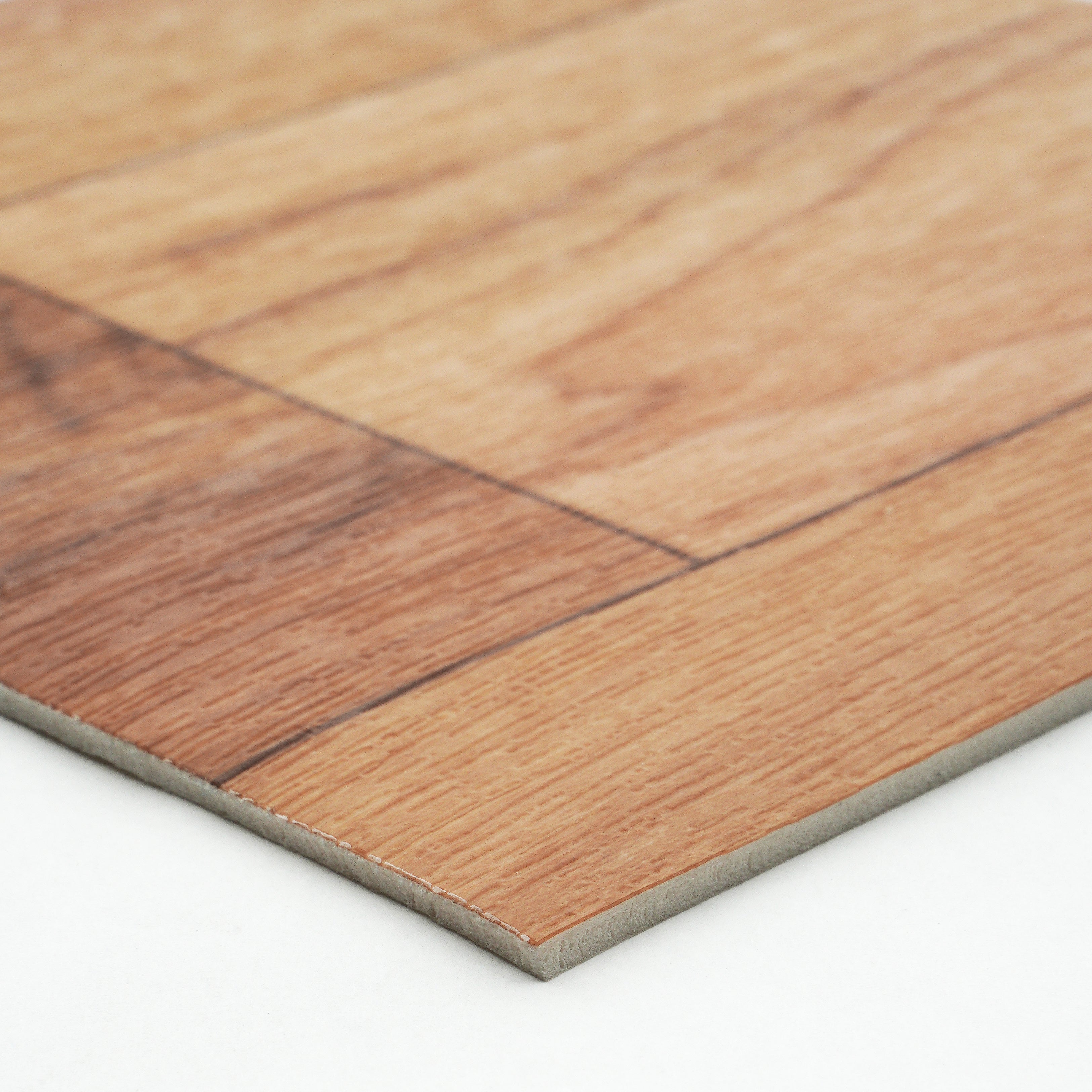 Close-up of brown wood laminate flooring with a smooth finish and durable backing material.